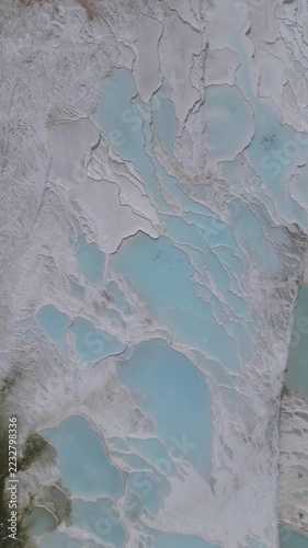 Aerial view of breathtaking natural site of white travertine thermal terraces, Pamukkale, Türkiye	
