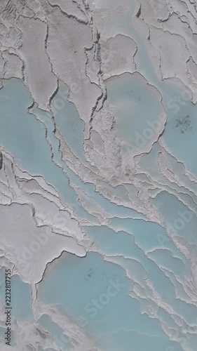 Aerial view of breathtaking natural site of white travertine thermal terraces, Pamukkale, Türkiye	
