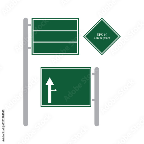 Set of green road signs with white borders, including a rectangular highway sign with three horizontal sections, a diamond-shaped warning sign, and a rectangular directional sign with an arrow