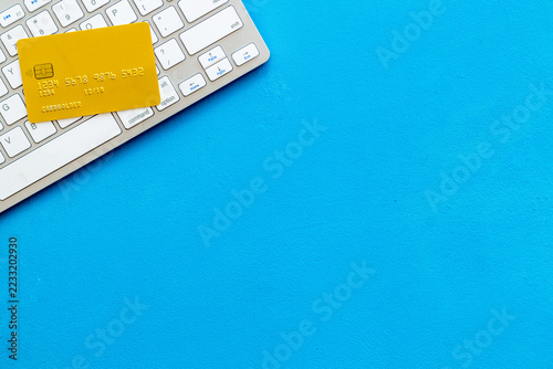 Pay by card concept and keyboard on blue background top view moc