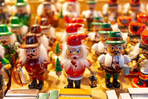 Colorful wooden nutcracker figurines displayed at a Christmas market in Salzburg, Austria.