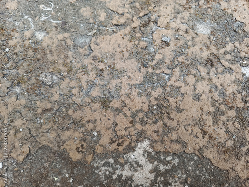 Obraz na plátně Weathered stone surface with cracked, patchy textures