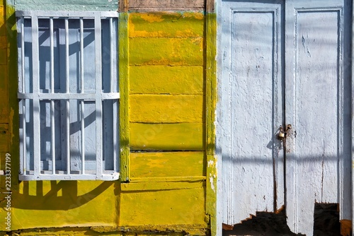 Rustic yellow wooden house,, traditional Caribbean architecture detail.
