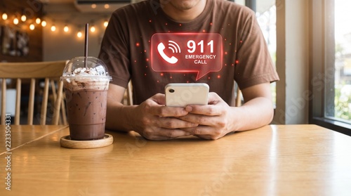 Man holding smartphone making urgent emergency call in cafe setting