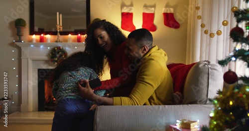 Obraz na plátně couple enjoys a festive moment at home