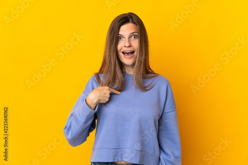 Fotografie Young Slovak woman isolated on yellow background with surprise facial expression