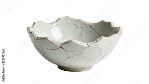 Obraz na plátně Isolated decorative artisanal ceramic bowl with unique cracked texture and organic wavy rim