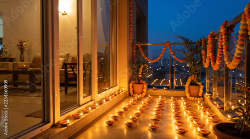 Urban Apartment Balcony Illuminated with Festive Oil Lamps at Twilight