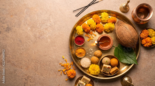 Traditional Diwali Puja Thali with Brass Diya and Marigold Flowers