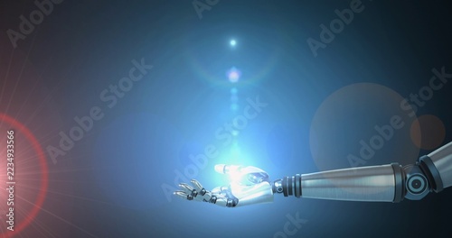 Extending robotic forearm and hand emitting glowing blue orb in blue studio, lens flares