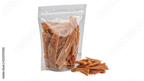 Fotografie Dried spicy jerky beef meat sticks pieces inside plastic packaging isolated on transparent background