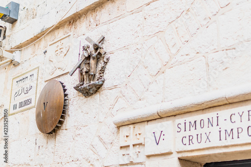 Fotografie Jerusalem's Via Dolorosa fifth station depicting Simon of Cyrene