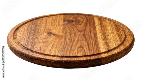 Fotografie Round wooden serving board with natural grain texture and grooved edge