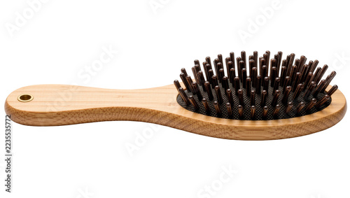 Fotografie Oval bamboo hair brush with dark brown plastic bristles and wooden handle