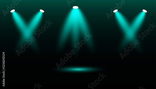 Bright teal stage lights creating a dramatic artistic spot light effect on dark background