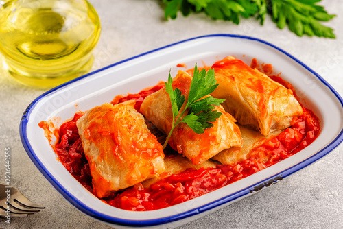 Delicious stuffed cabbage rolls served with tomato sauce